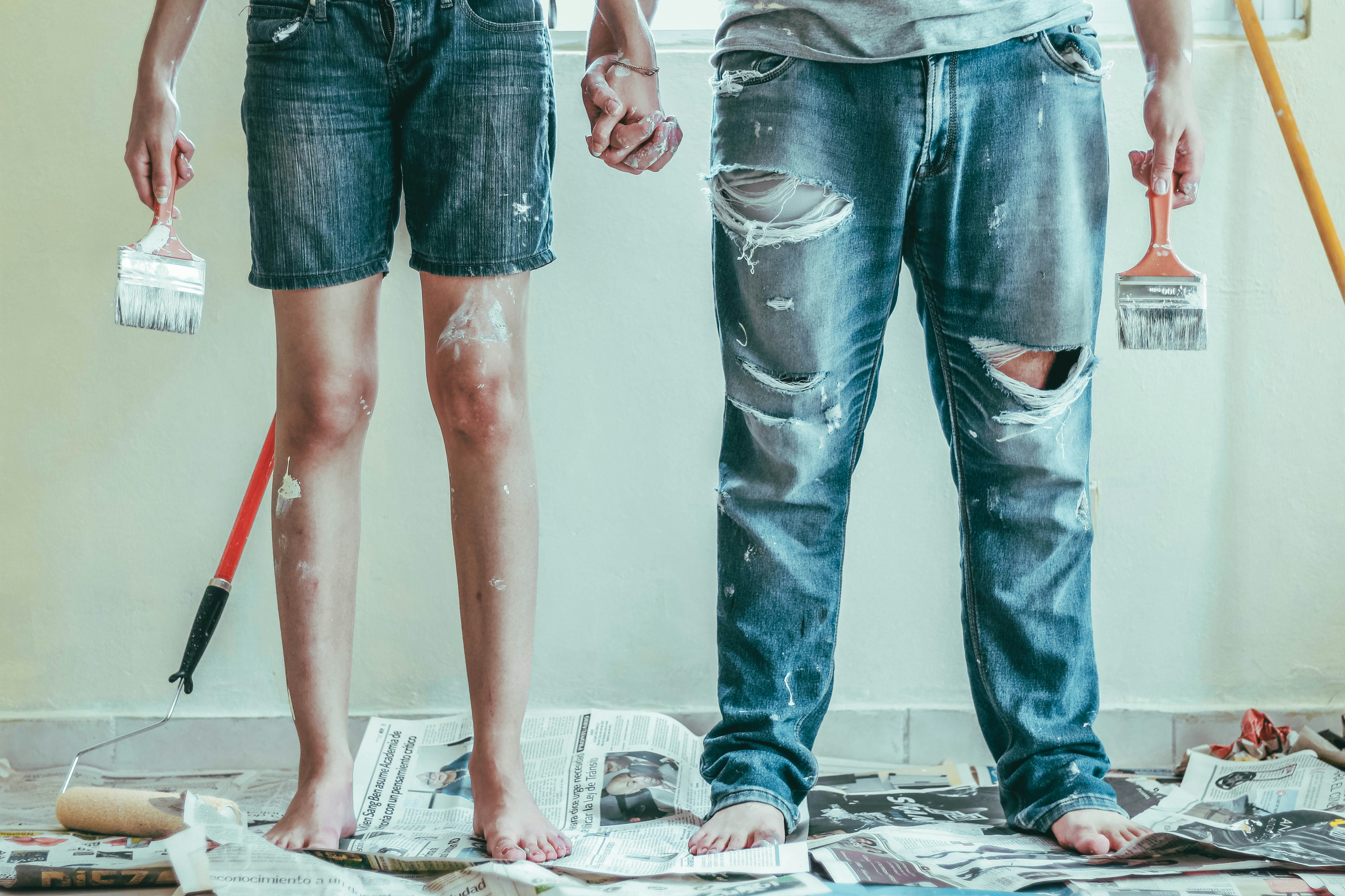 Man and woman holding hands during DIY project