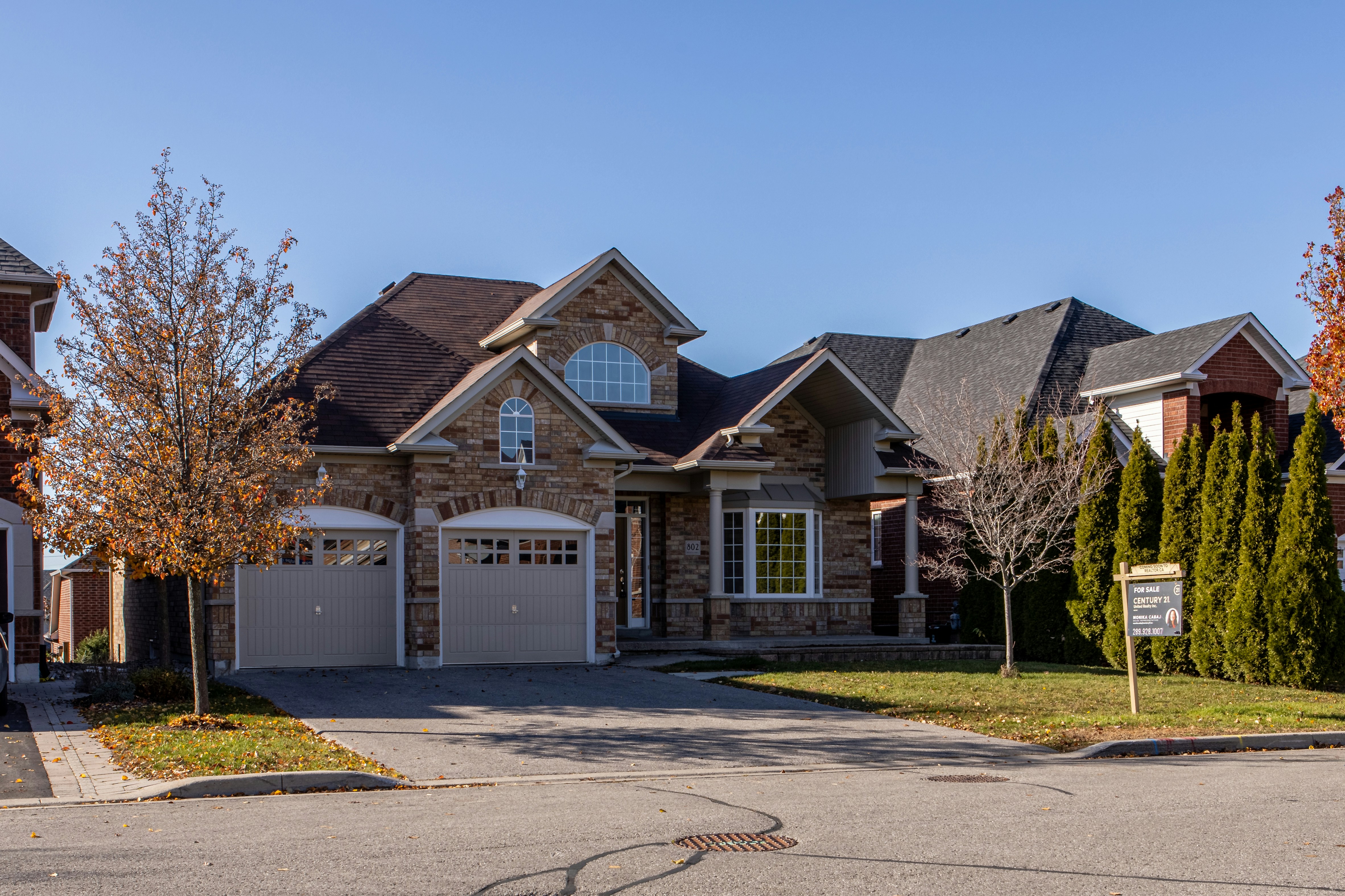 House with for sale sign out front